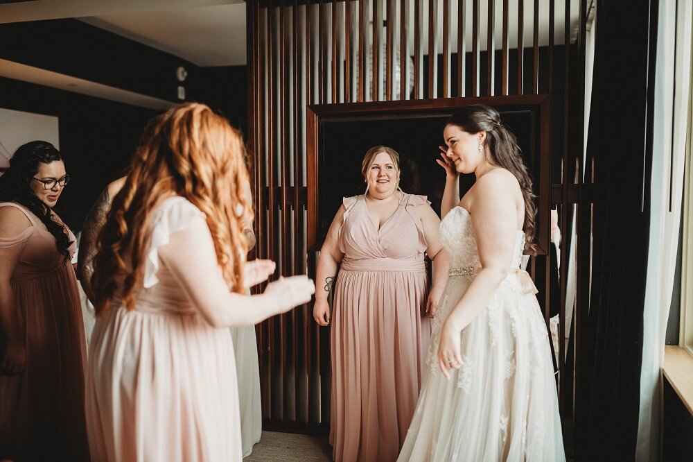 Bride and bridesmaids getting ready at hotel first look