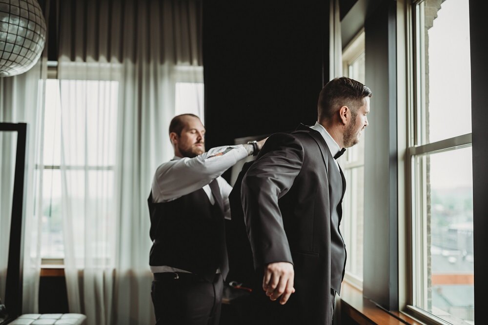 groom getting ready in hotel