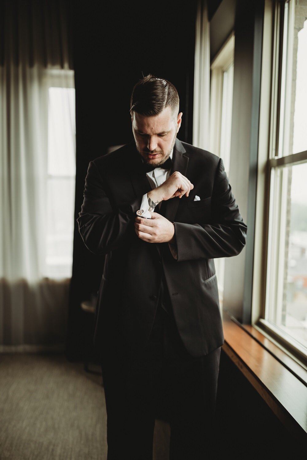 groom getting ready in hotel