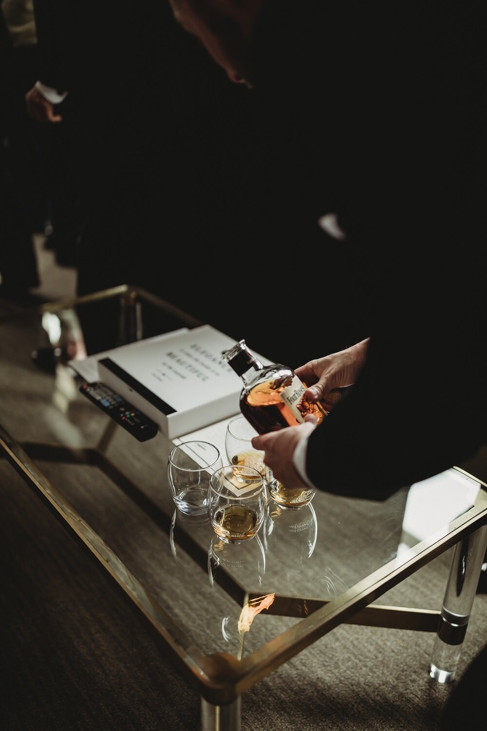 groom pouring a drink