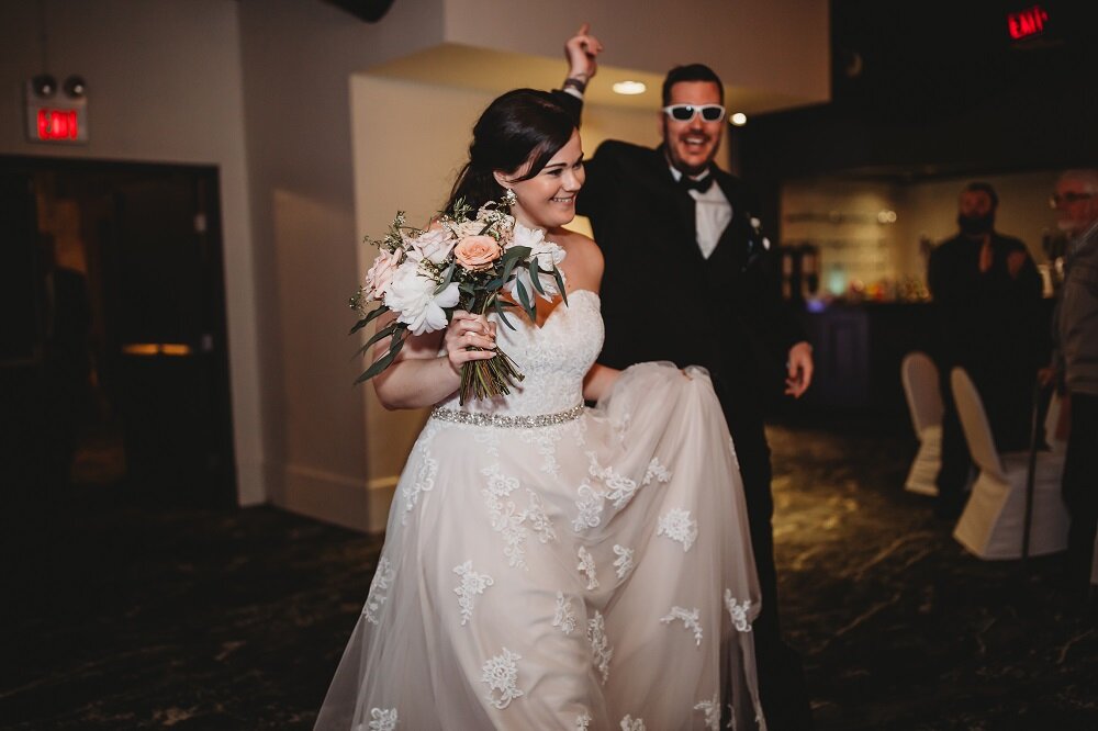 bride and grooms wedding entrance to reception 