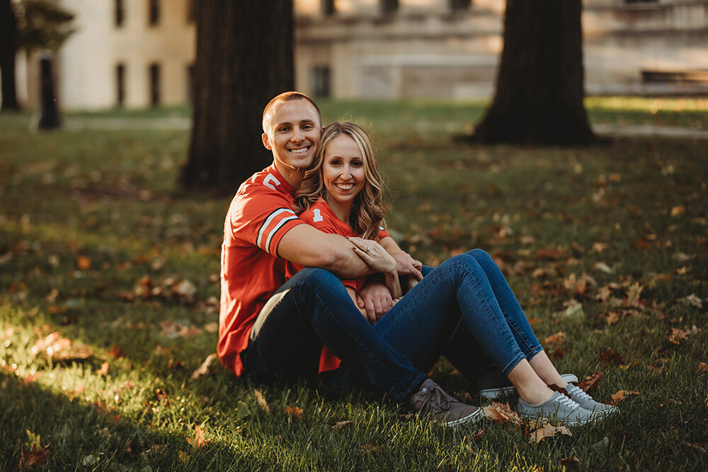Engagement portraits of couple wearing ohio state university jerseys.