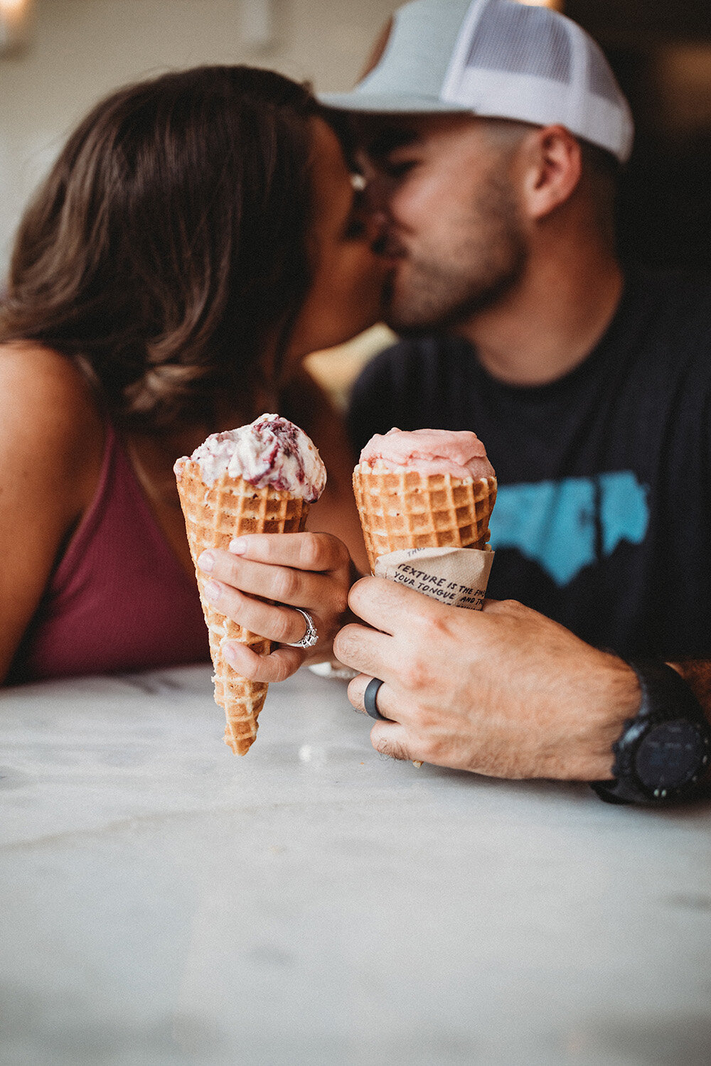 couple holding ice cream cones