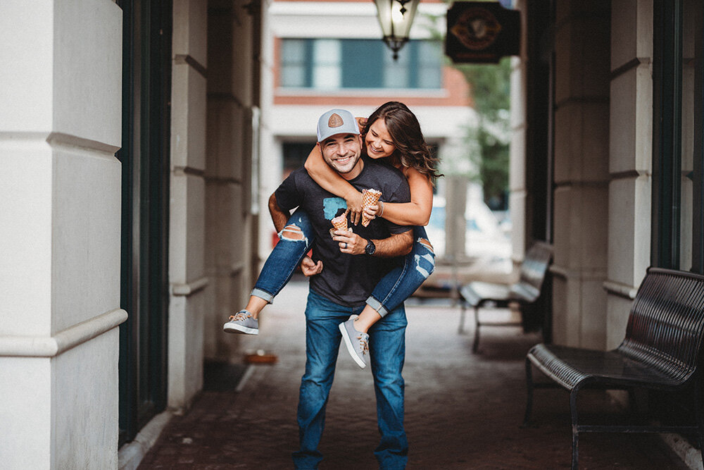 couple giving each other piggyback rides