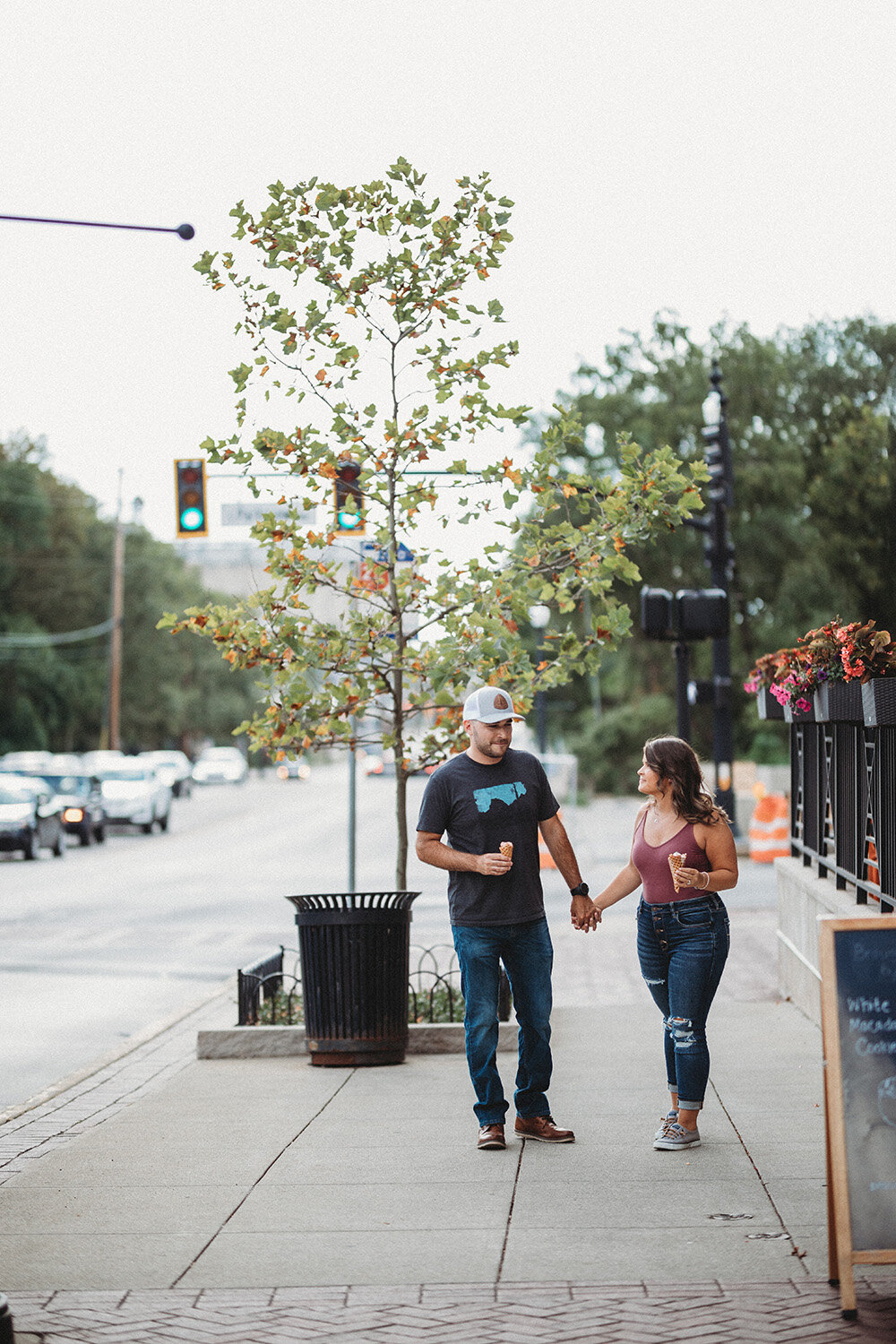 couple walking downtown holding hands