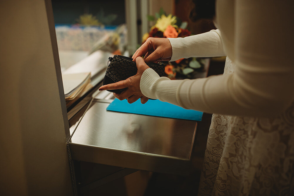 bride going through her wallet 