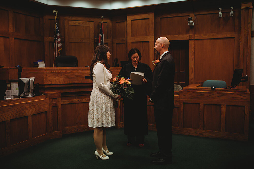 bride and groom getting married at courthouse