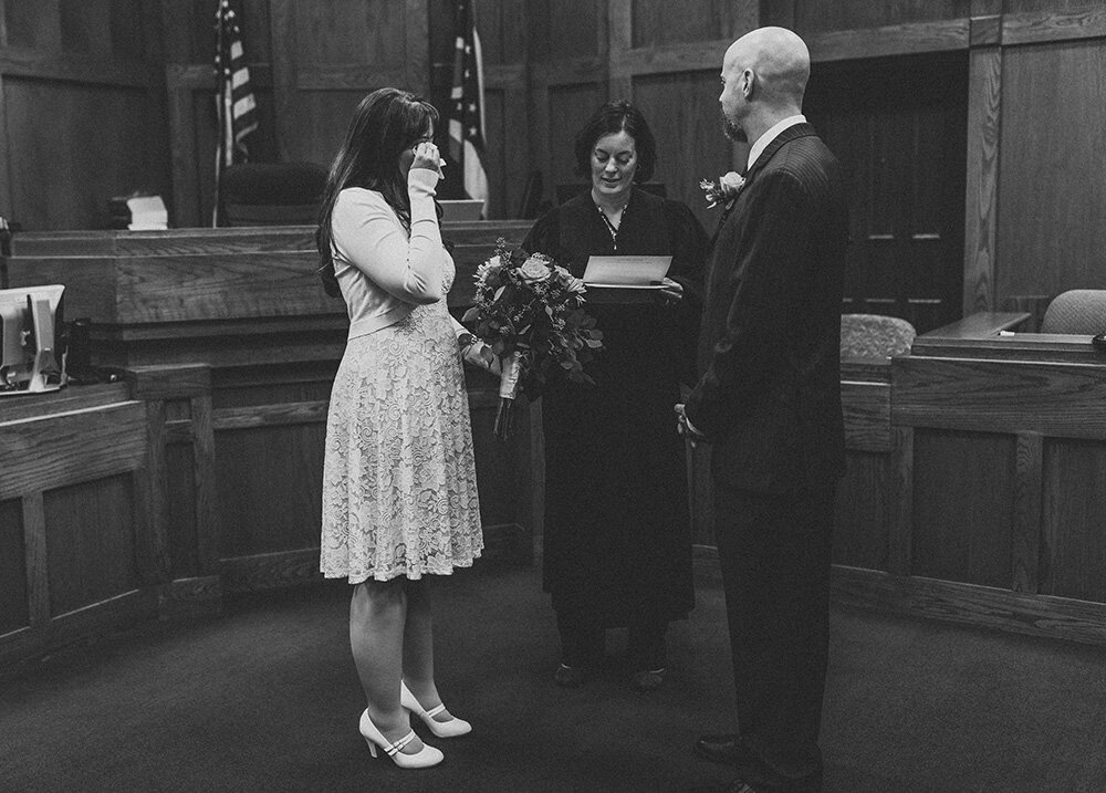 bride and groom getting married at courthouse