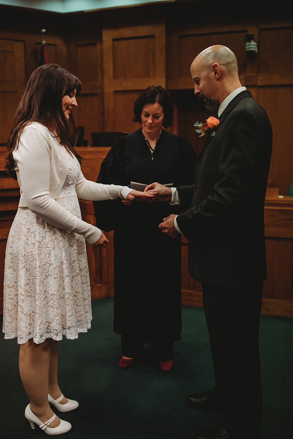 bride and groom getting married at courthouse