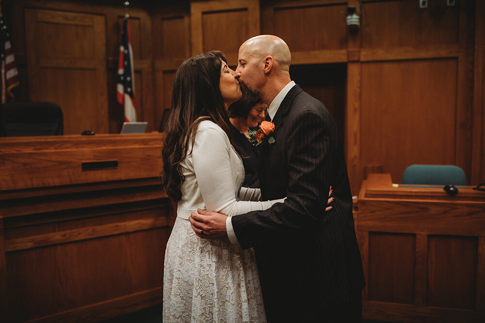 bride and groom getting married at courthouse