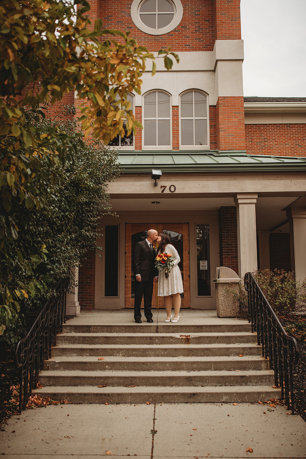 bride and groom share a kiss