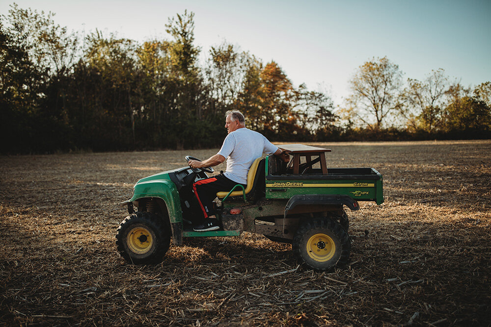 farmer on golf cart 