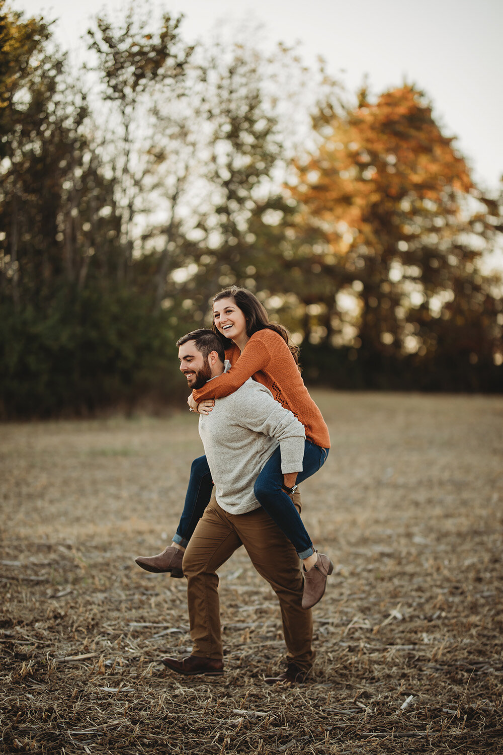 couple giving each other piggyback rides