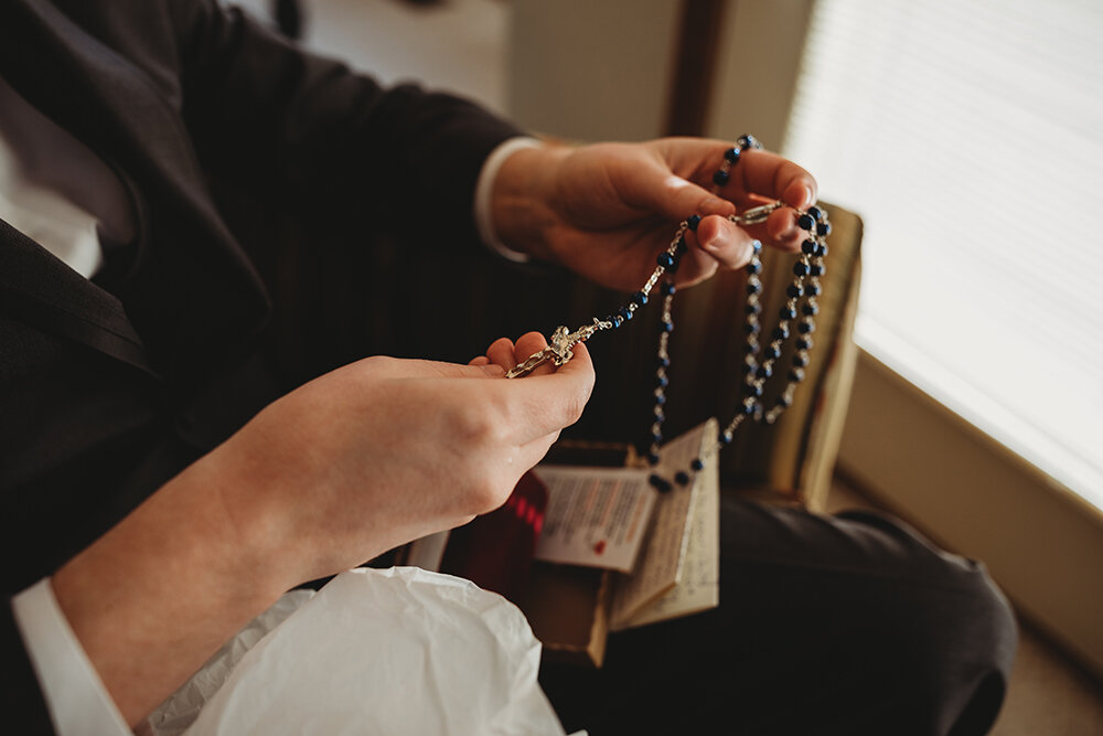 groom opening a gift from bride 