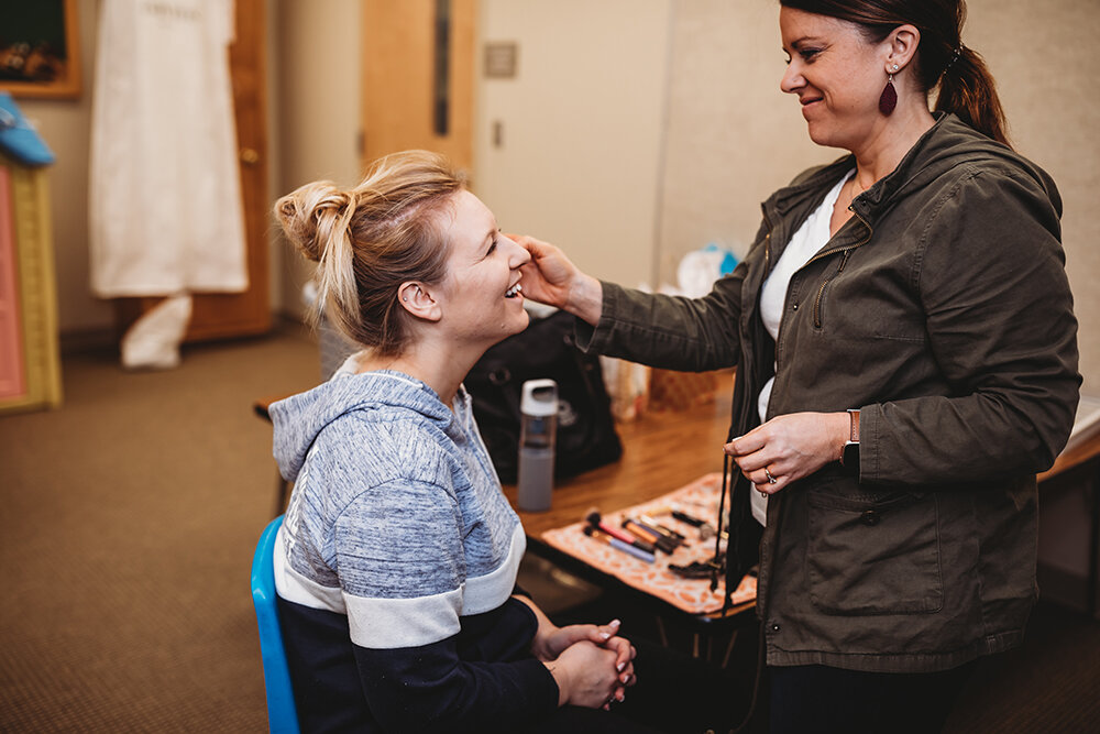 bride getting her makeup done