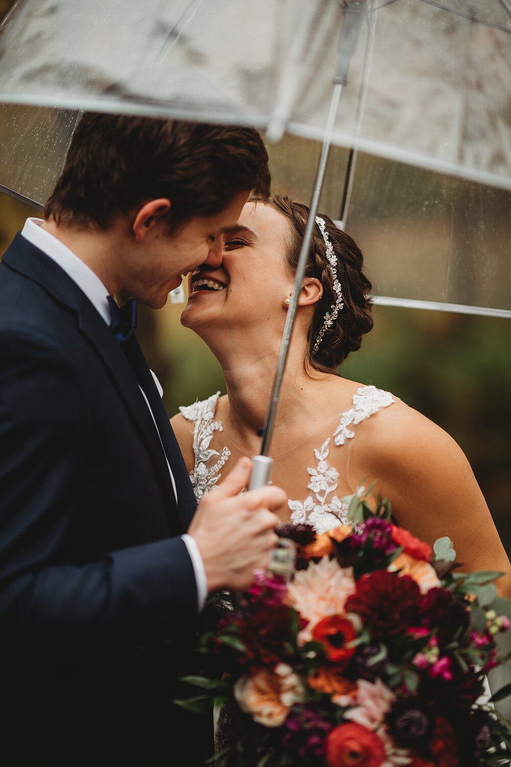 bride and groom portraits under umbrella 