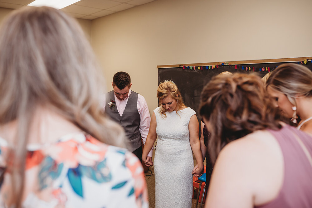 wedding party praying 