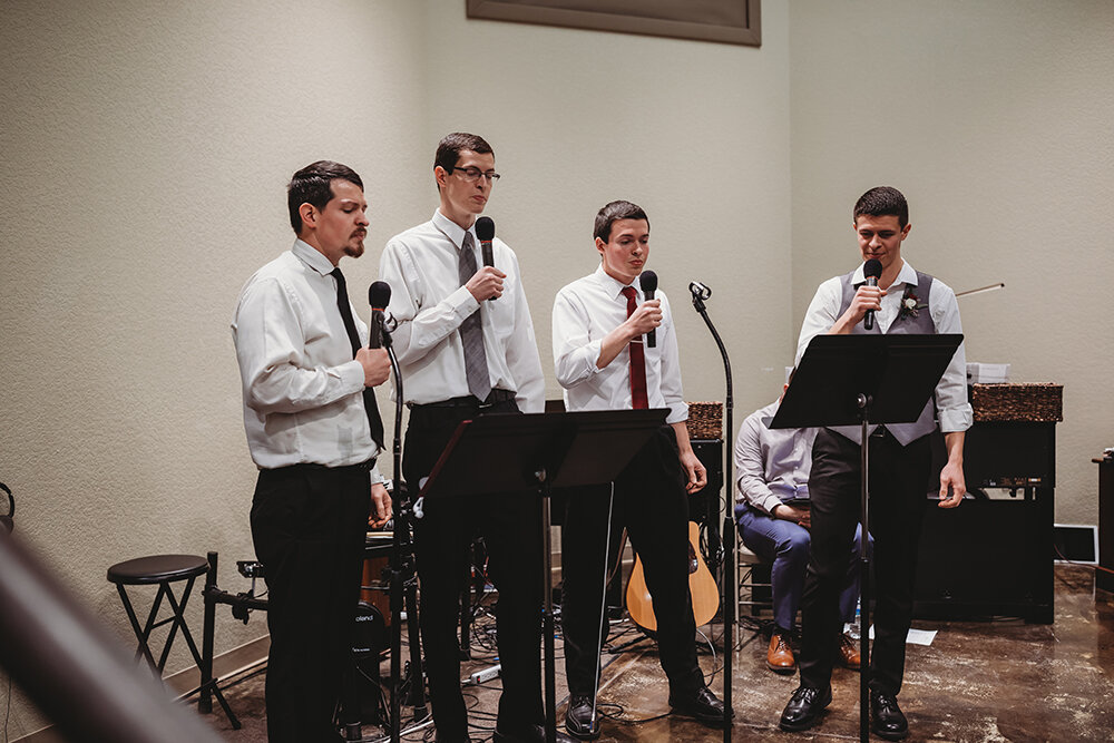 groomsmen singing at wedding 