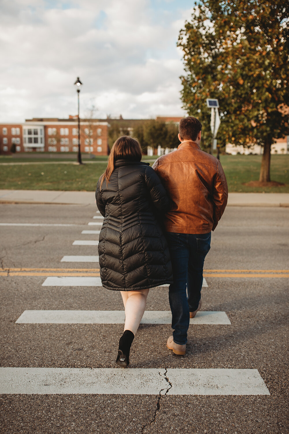 couple walking on crosswalk 