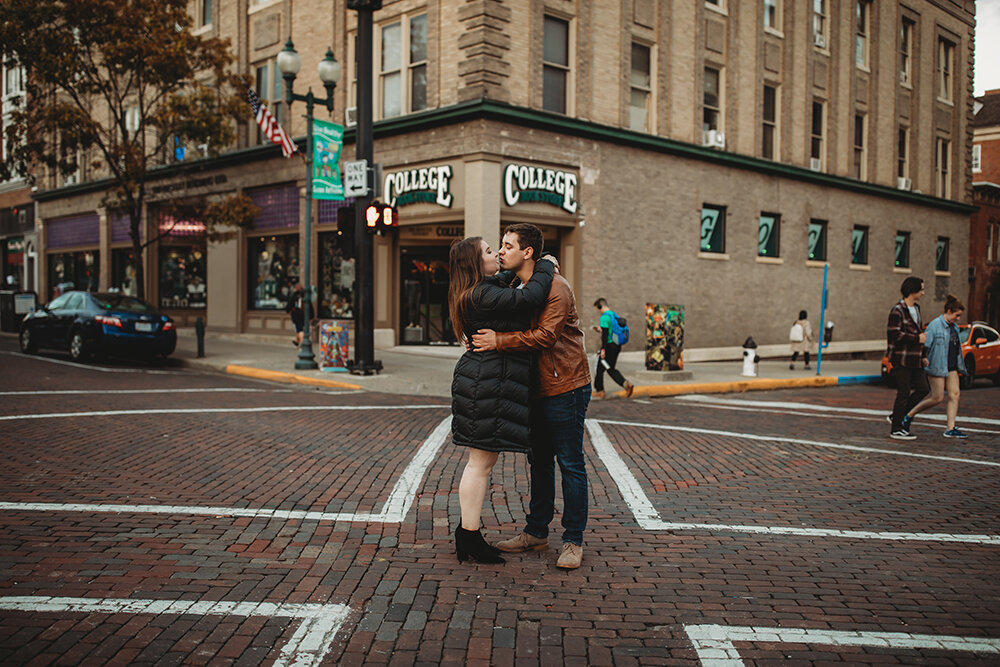 couple kissing in the street 