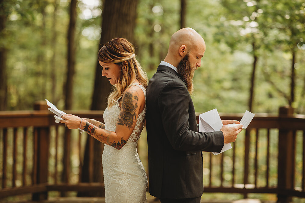 bride and groom reading letters 