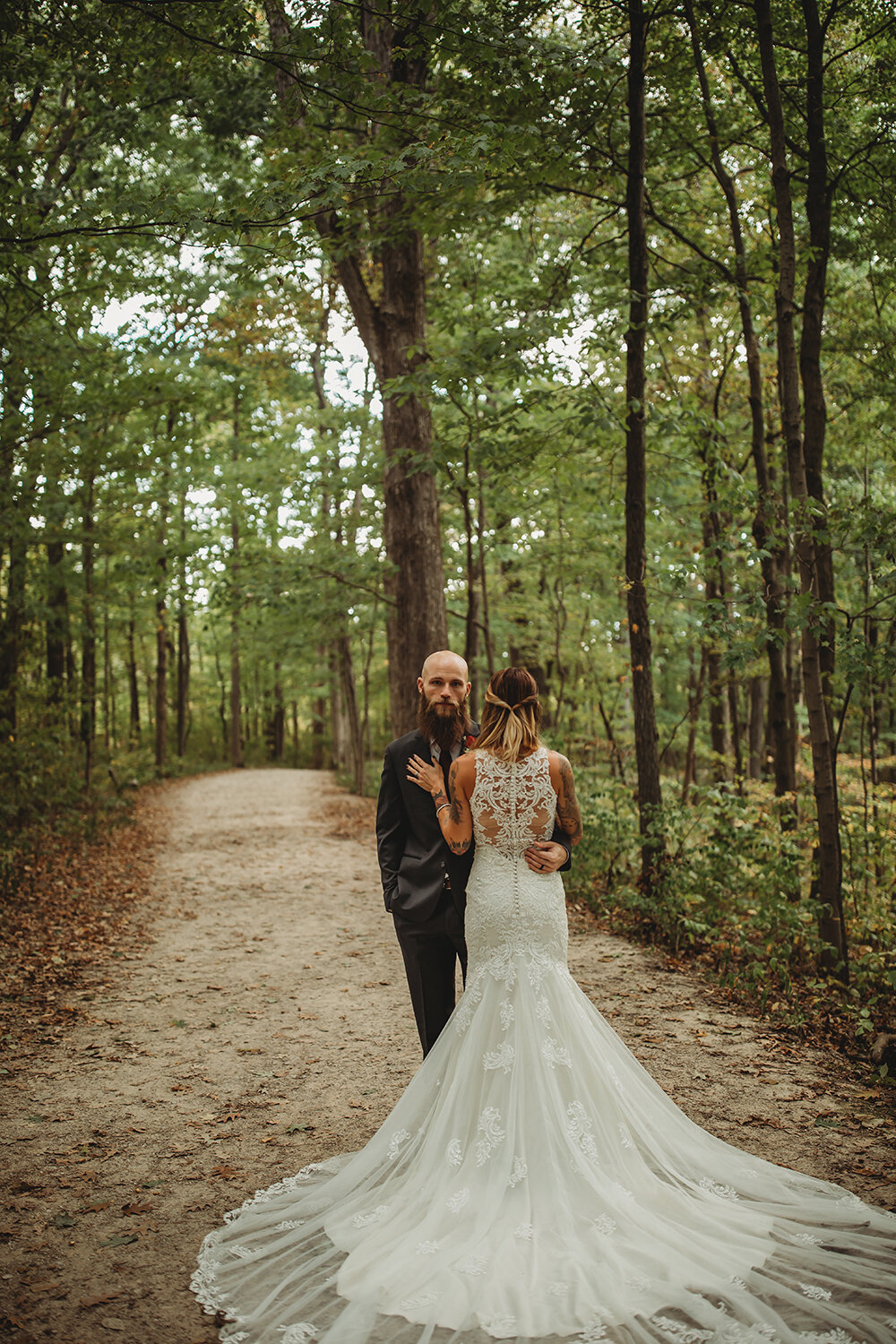 bride and groom wedding portraits in the woods 