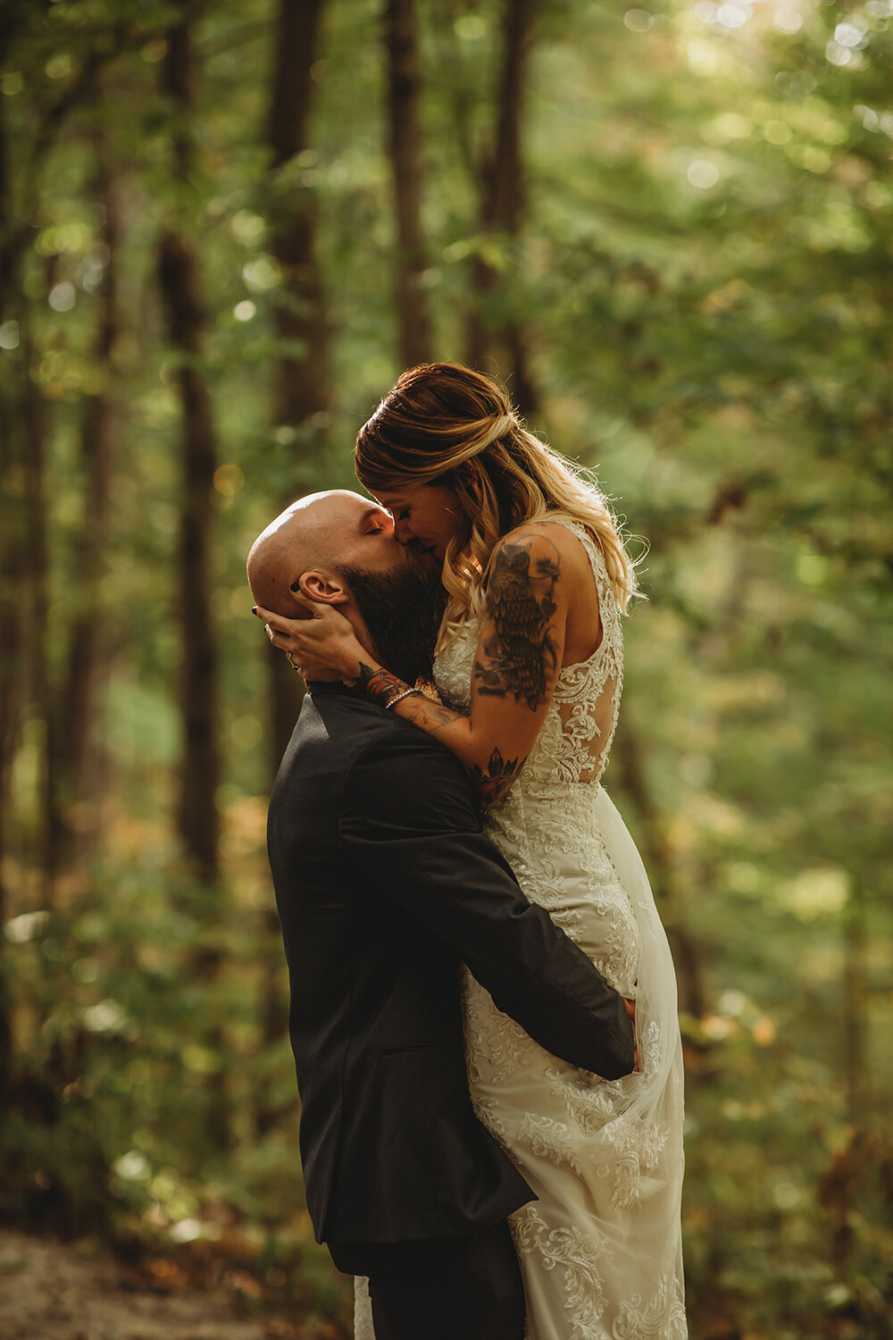 bride and groom wedding portraits in the woods