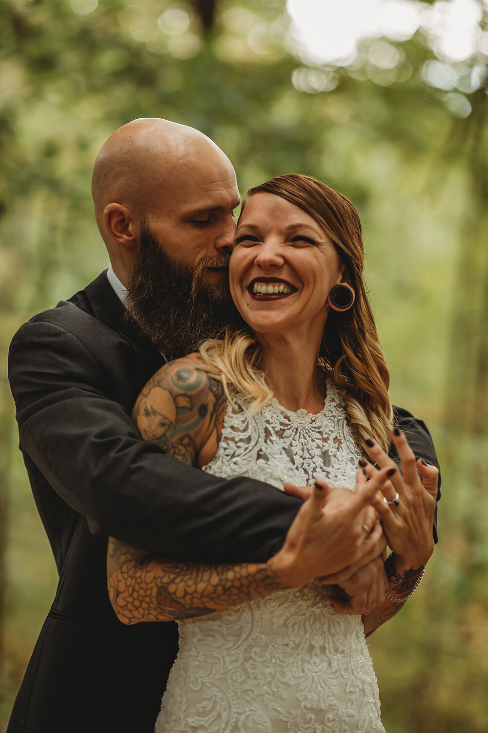 bride and groom wedding portraits in the woods