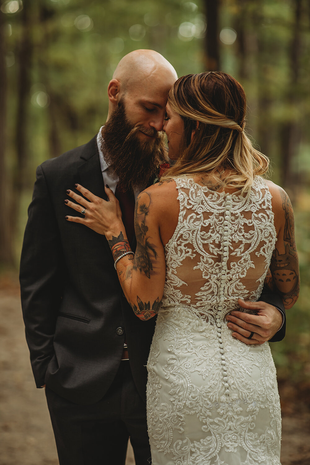 bride and groom wedding portraits in the woods