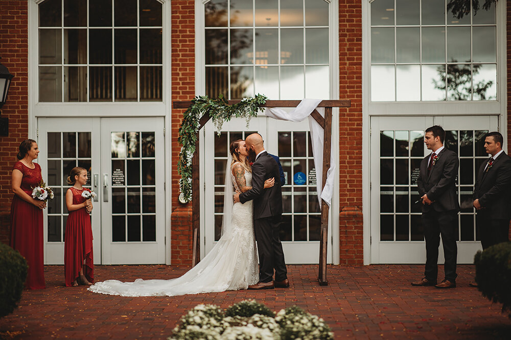 bride and groom at altar 