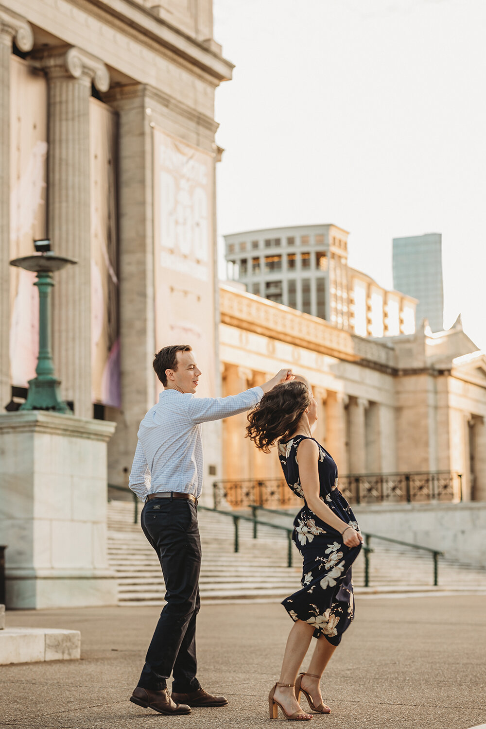couple dancing in front of museum 