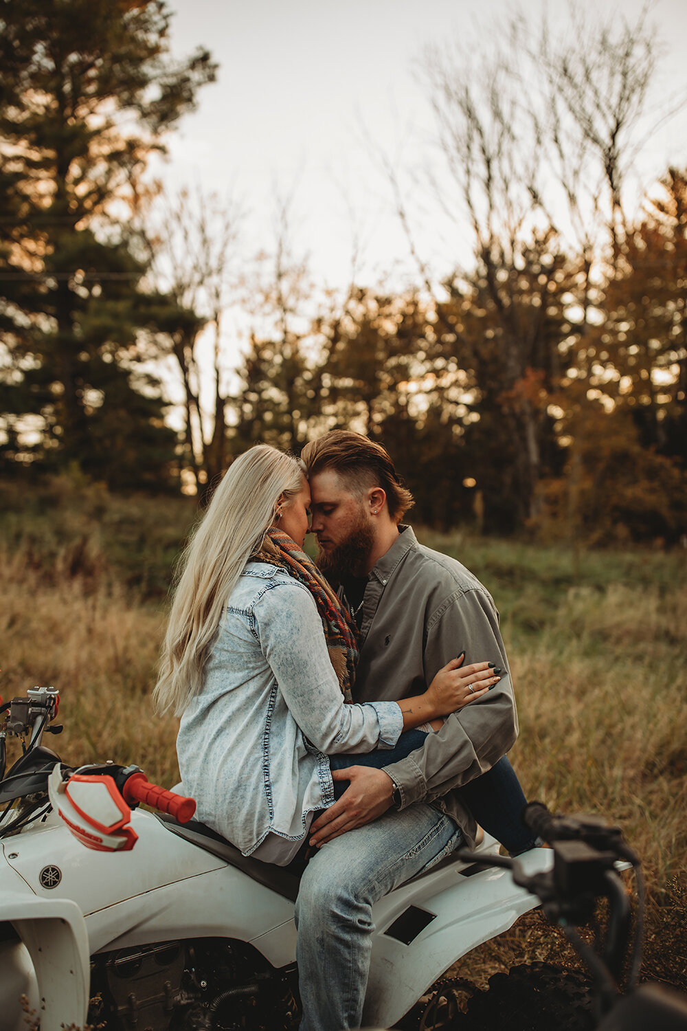 couple sitting on atv