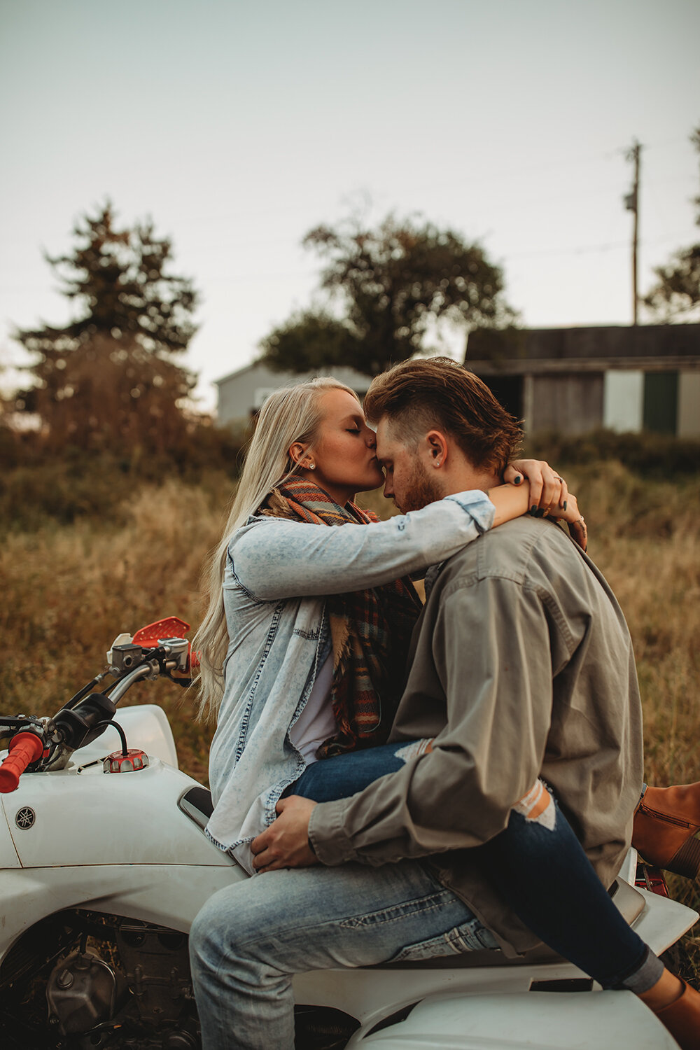 couple sitting on atv