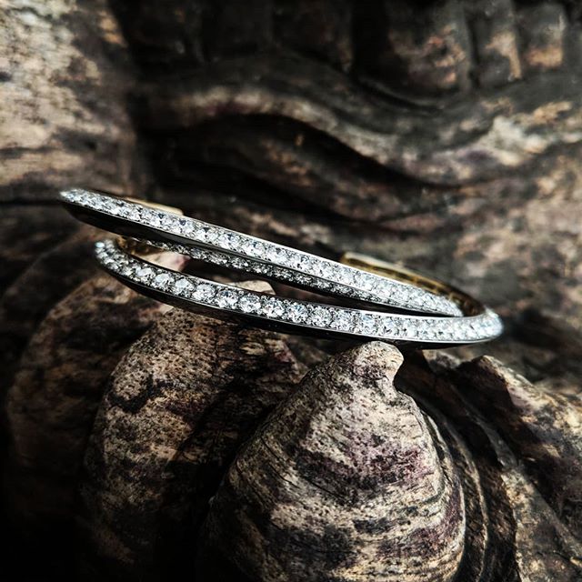 A pair of knife edge cuffs, with half side pave with white diamonds. #mrlieou #Diamond #cuff