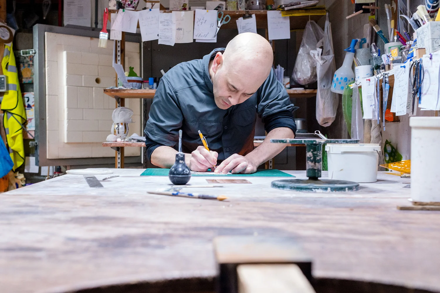 lee-page-hanson-ceramics-designing-at-the-studio.jpg