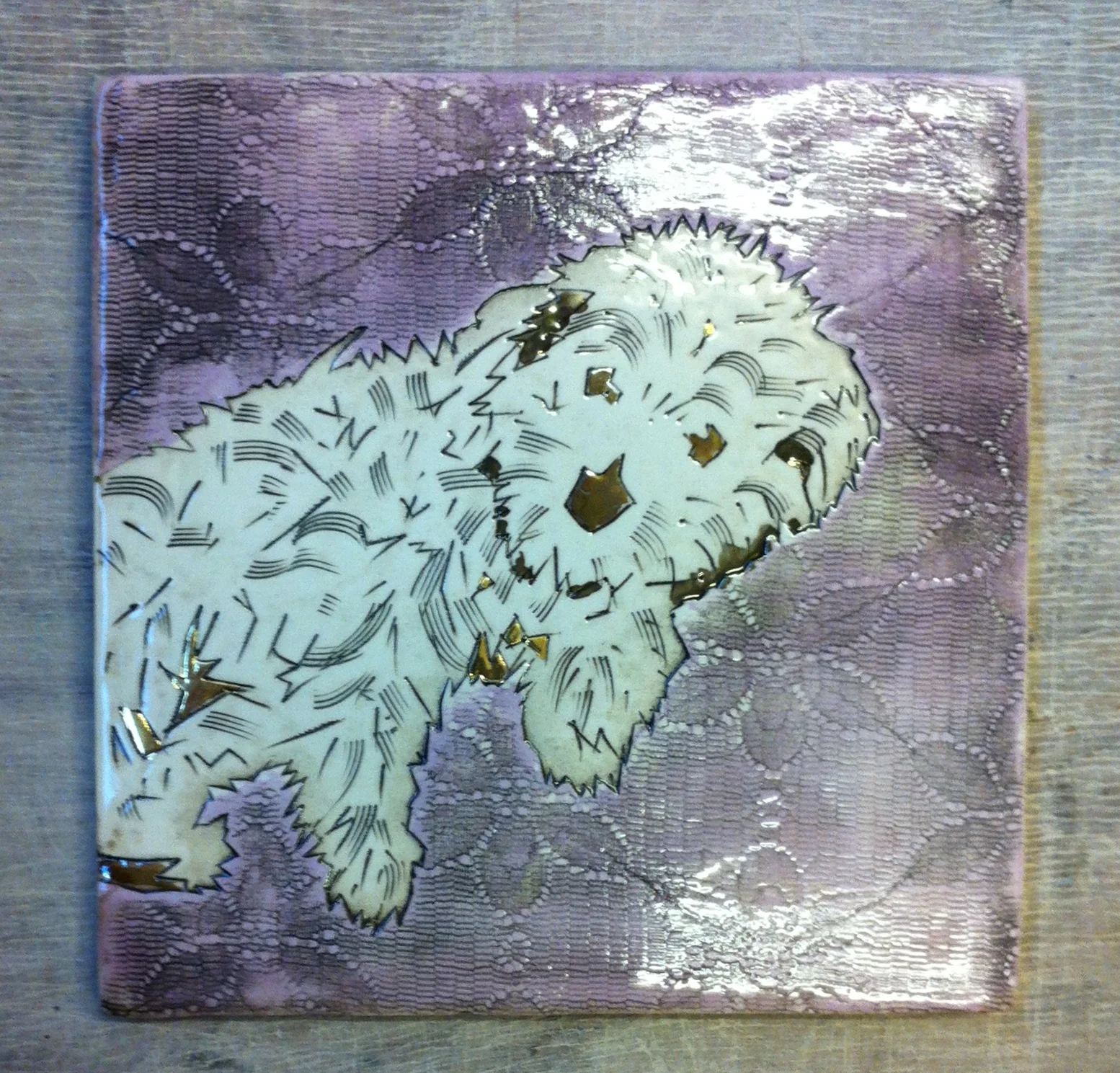 This is Bun Bun, psycho terrier contary to fluffy first impressions. His owner Mr Scruff wanted a tile to commemorate Bun Bun’s entry into the guinness book of records for fluffies dog on the planet. He emailed me a photo of Bun Bun and this is I tile I made.