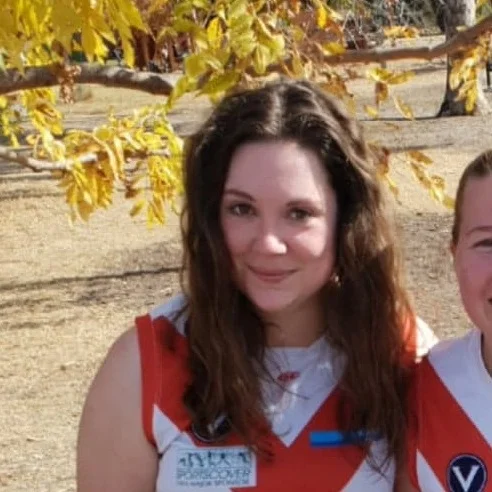 Em B Em is another successful graduate from the SMDFC skills academy. She has been proudly running out in the number #68 jumper- mixing it up on the ground in the both front and back pockets. One skill that Em has not cracked out on the field is her ability to walk on her hands- maybe a goal scoring celebration? Off the field Em works in international student recruitment, plays with other peoples dogs in parks (this is a Bloods theme) and reading true crime articles whilst not being able to live without her Burts Bees Lip Balm- not a bad thing for footy in the winter.