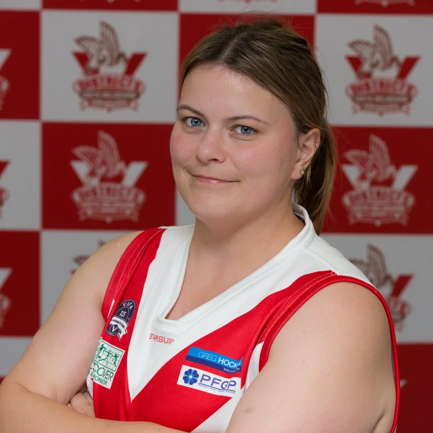 Alix Our all-seeing and knowing player come coach, Alix, is back on the oval this year sporting the #32 jersey and holding the Front line fast! Al began playing footy way back in 2005 and in the last 12 years has smashed goal after goal out and has gone on to qualify as a coach in the last 2 years. When she’s not kicking a footy you’ll find Alix in a movie theatre checking the newest releases, probably with Oreo by her side- no not the chocolate, her ever faithful dog. If you ever lose Alix you’ll be sure to find her fussing over the nearest K9!