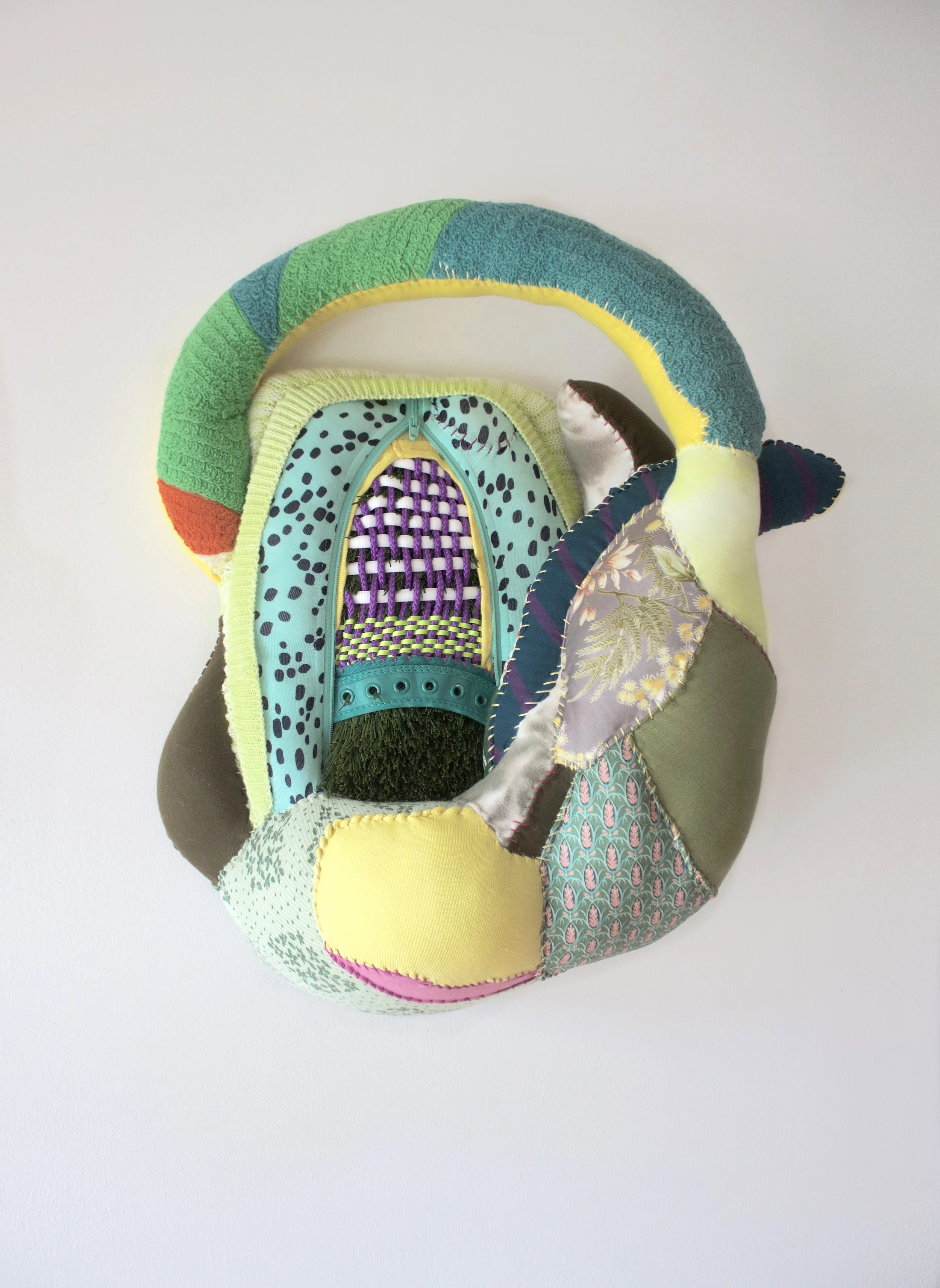 Always Greener, 2025   Recycled textiles, thread, batting, astroturf, ribbon, nylon rope, wood   20 x 16 x 8"