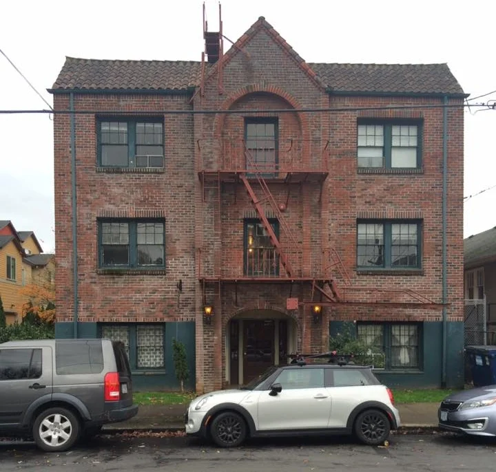 1920s small apartment building on a single lot.