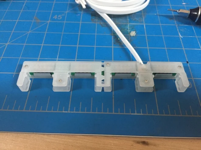  To account for both 4 pole and 2 pole main breakers we had to get creative. This breakout hub was designed to be snapped in half or used whole, depending on the use case. The goal was to reduce the number of parts and wires necessary to install the 