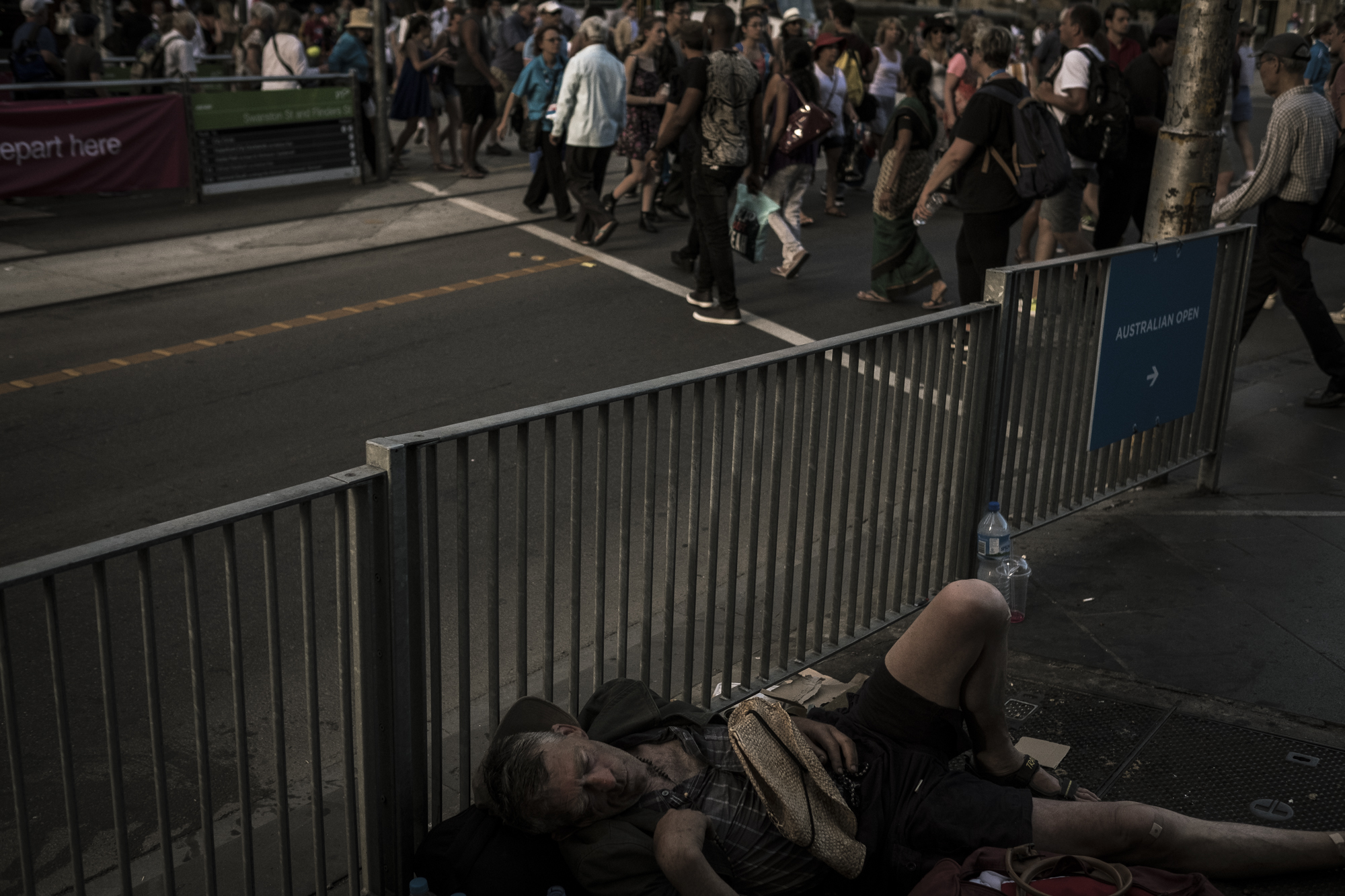  Flinders Street, Melbourne, Australia. Asha Lang is seen sleeping in Melbournes streets. After having his belongings stolen and relinquishing his spot in the homeless camp on Flinders Asha is forced to sleep at Melbournes' busiest intersection; Flin