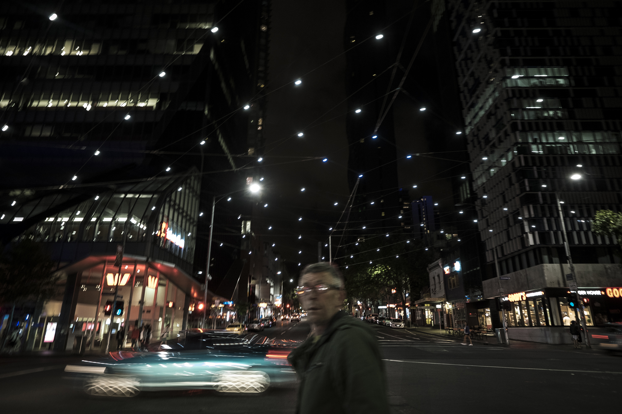  Lonsdale Street, Melbourne, Australia. Asha Lang is seen under fairy lights on Lonsdale Street, Melbourne. Asha spends most nights, particularly in summer, wandering the city of Melbourne. Always looking for cigarette butts but mostly to 'feel' the 