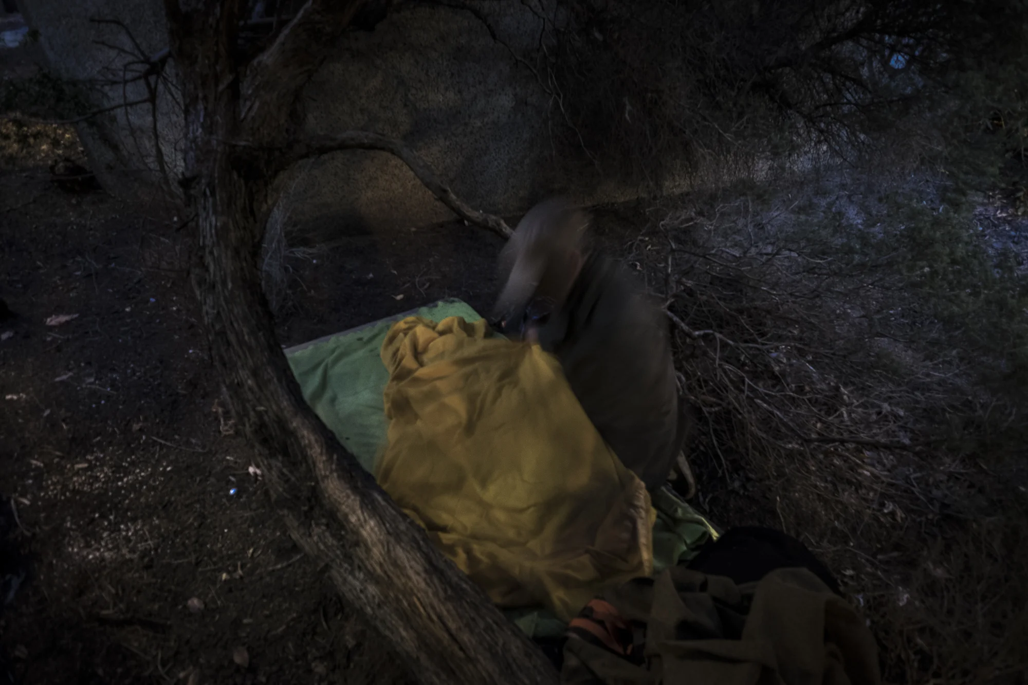  Sturt St, Melbourne, Australia. Asha rolls out his blankets in the secret sleeping quarters he has found for himself beneath a pedestrian bridge and between two busy carriageways. &nbsp;"Im tired, I have had enough. My body doesn’t handle it no more