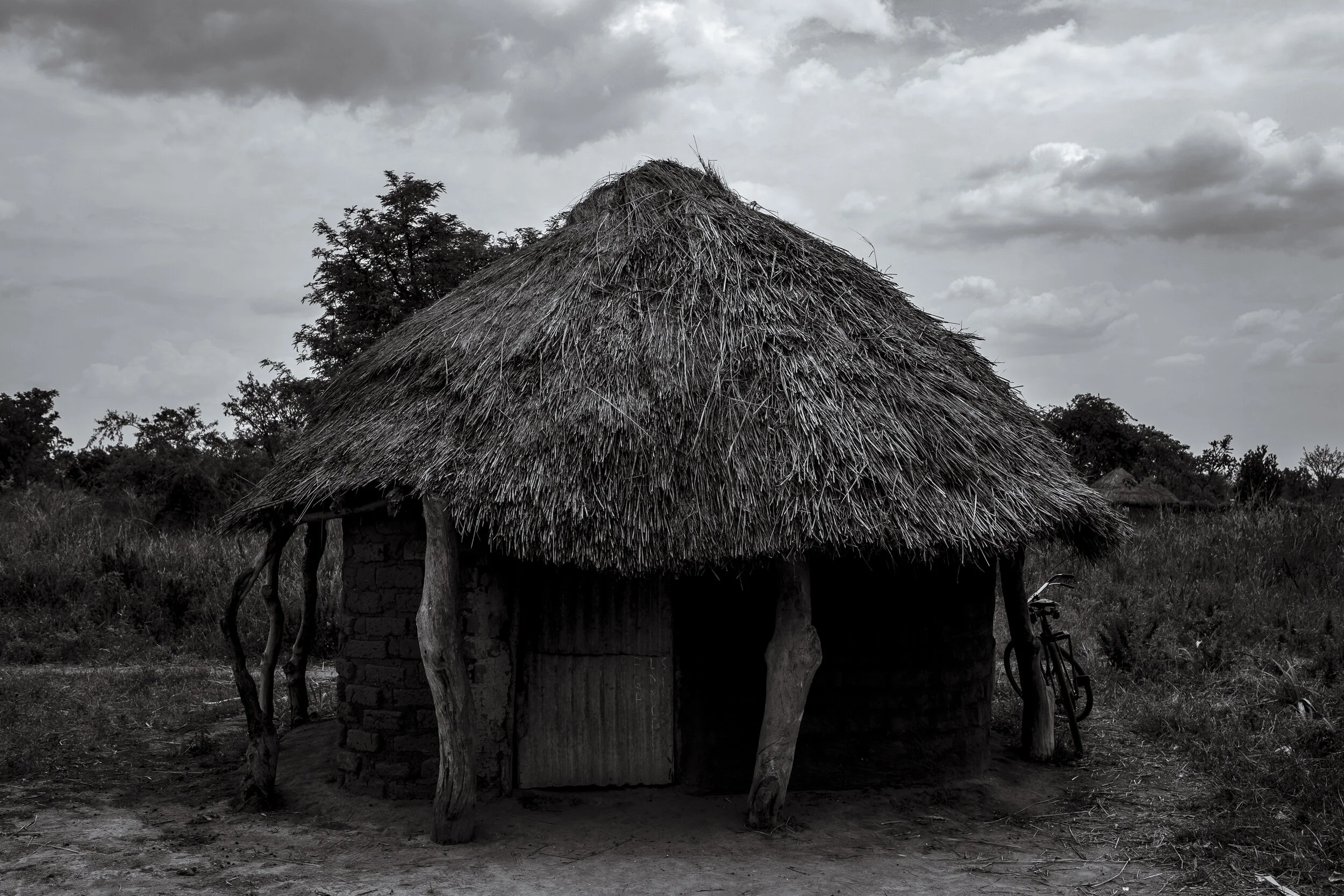  Obur, Soroti District. A village storehouse in Obur where twelve year old Catherine Asinge is bound by her right wrist to a chair.   