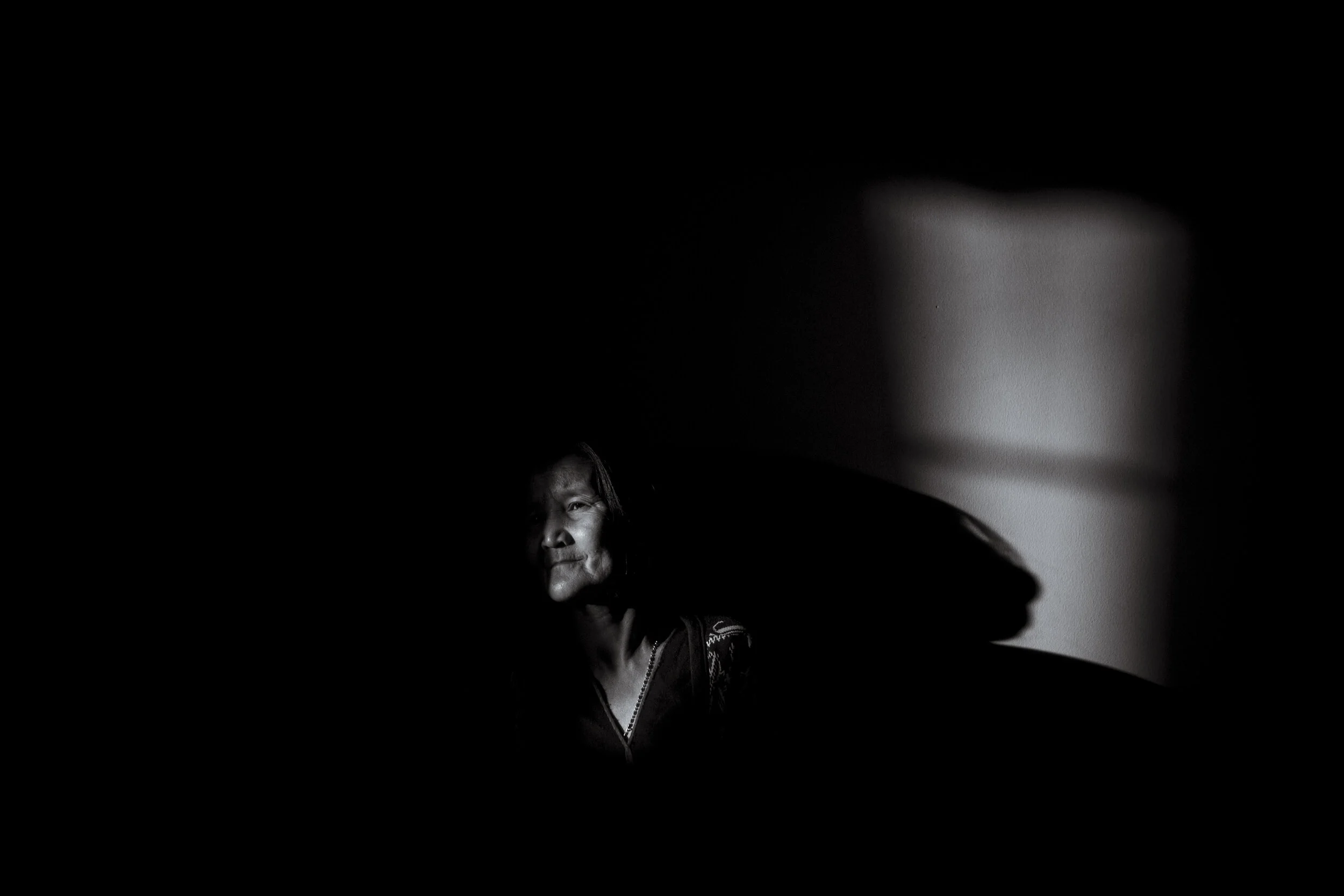  Wyndham Vale, Melbourne. Naw Sue Htoo leans on the living room wall and lets the late afternoon light warm her face. She fears the darkness, the trauma of her life in Burma apparent in her lack of energy. As a younger woman, Naw Sue’s village came u