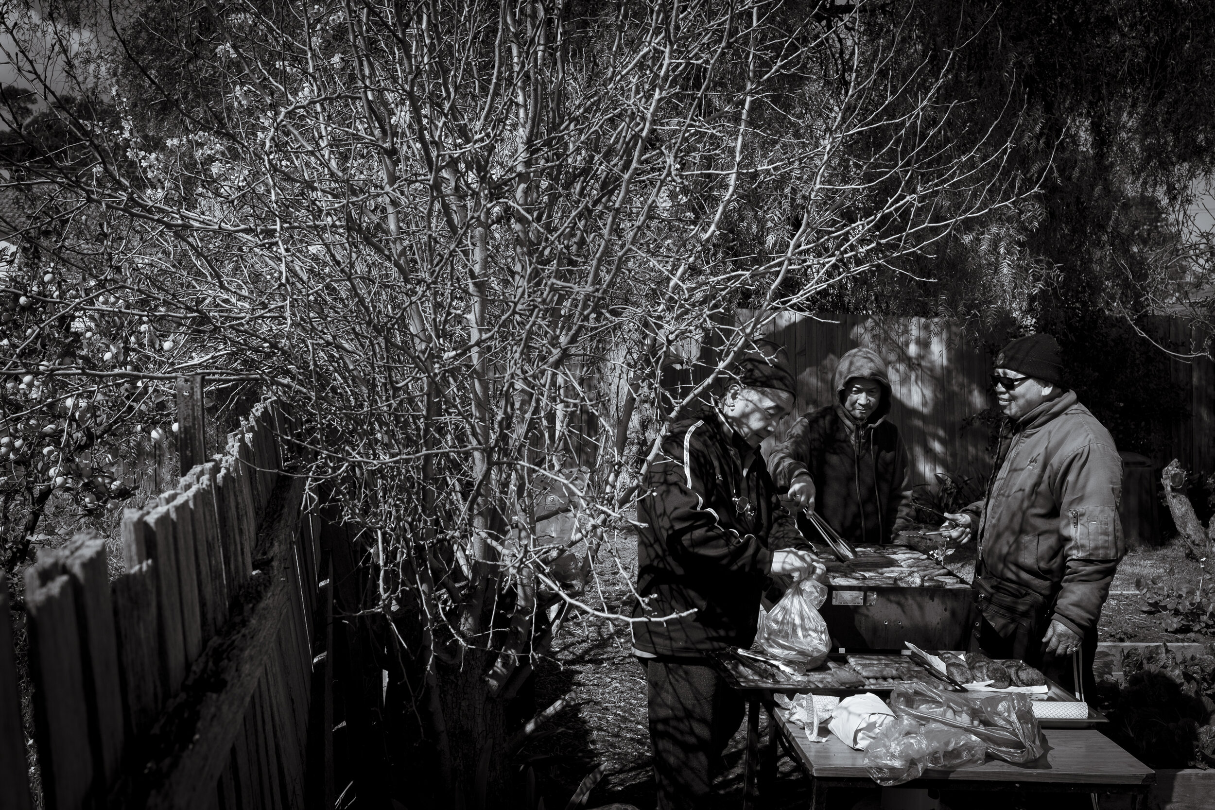  Werribee, Melbourne. Tha Toke, Saw Ha Paw Johny and Ooh Myaing cook a BBQ for guests at the WCEC open day as part of the Wyndham City's learning festival. As part of the re-settlement program run by WCEC, the elders of the community can join a men’s