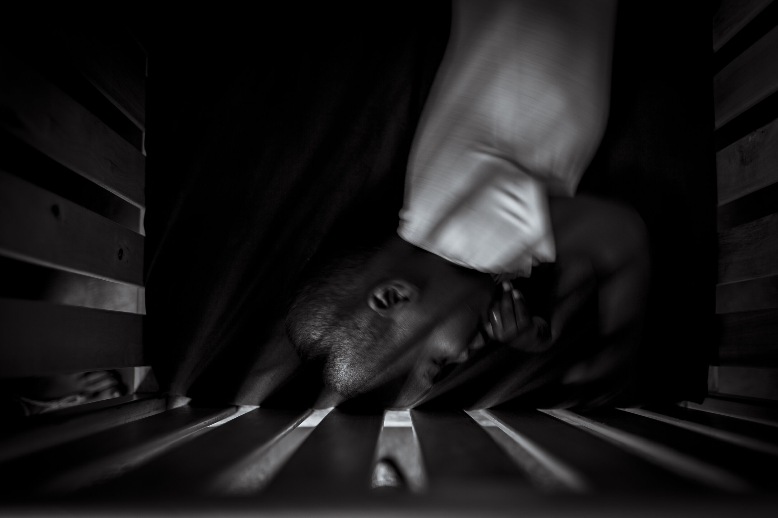  Kampala, Uganda. Aiden Waswa in his crib at Watoto Orphanage in Suube. Abandoned at birth the police took him to Suube, on the outskirts of Kampala, at age one he already receives trauma re-habilitation. 