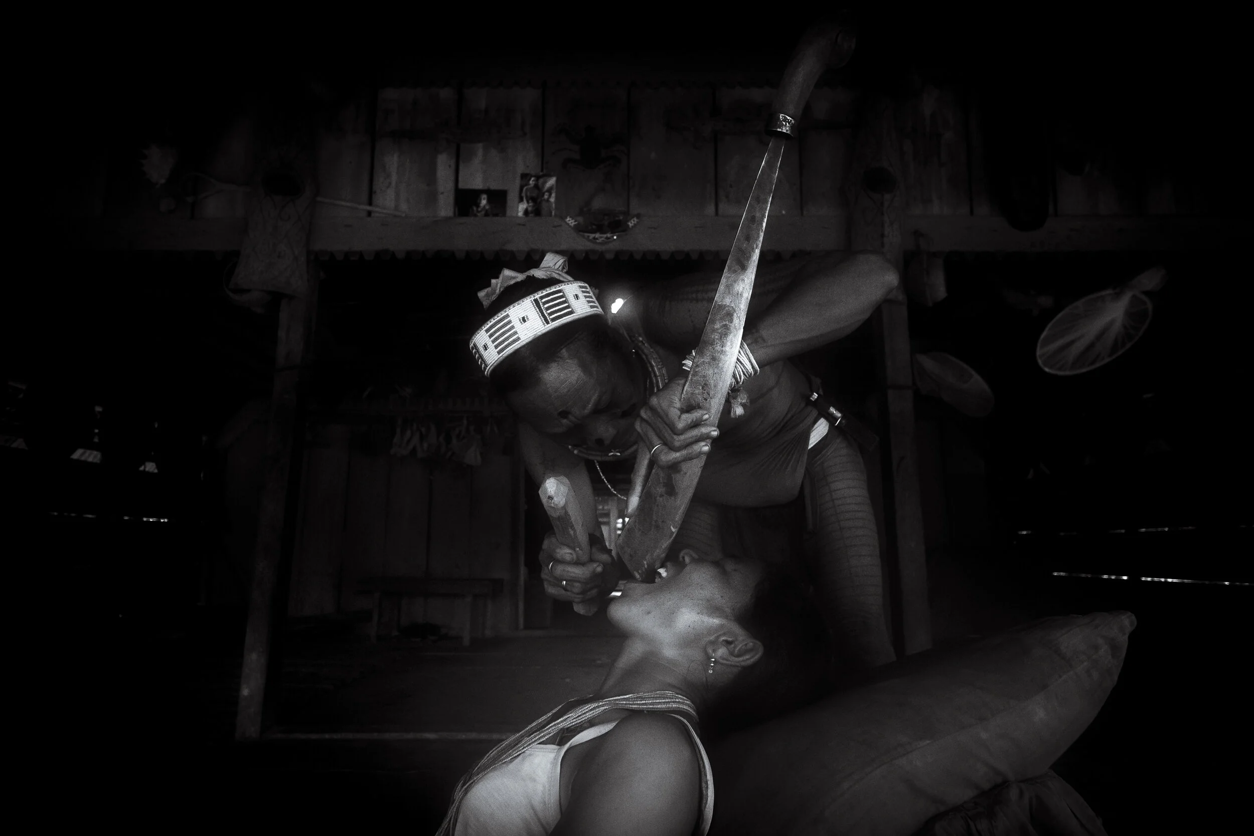  Masit Dere performs a tooth sharpening ritual. The procedure is performed less and less as Mentawai women continually look to the western world for what is deemed to be 'beauty'. The ritual has different purposes dependent upon which region it is pe