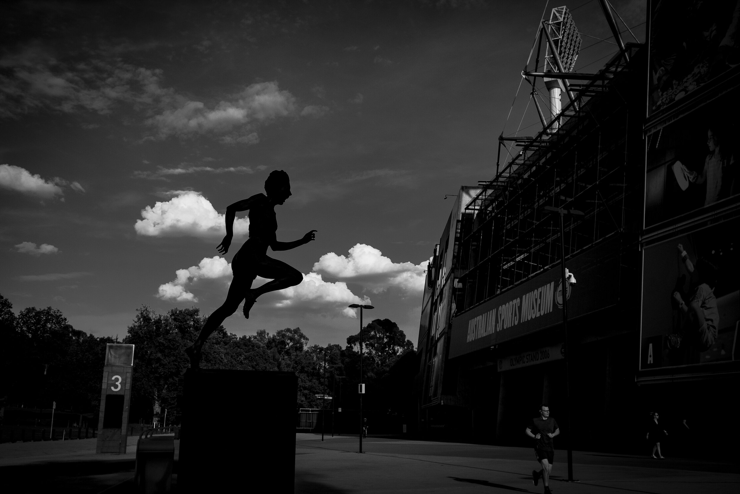  27/03/20 16:52 pm, MCG, East Melbourne. Twilight in autumnal Melbourne at the iconic sporting venue would generally see a hive of AFL football fans queuing to see their team battle for premiership points. Overseen by the legend of Betty Cuthbert,  a